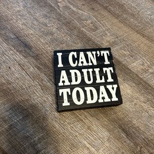 “I can’t adult today” decorative sign.